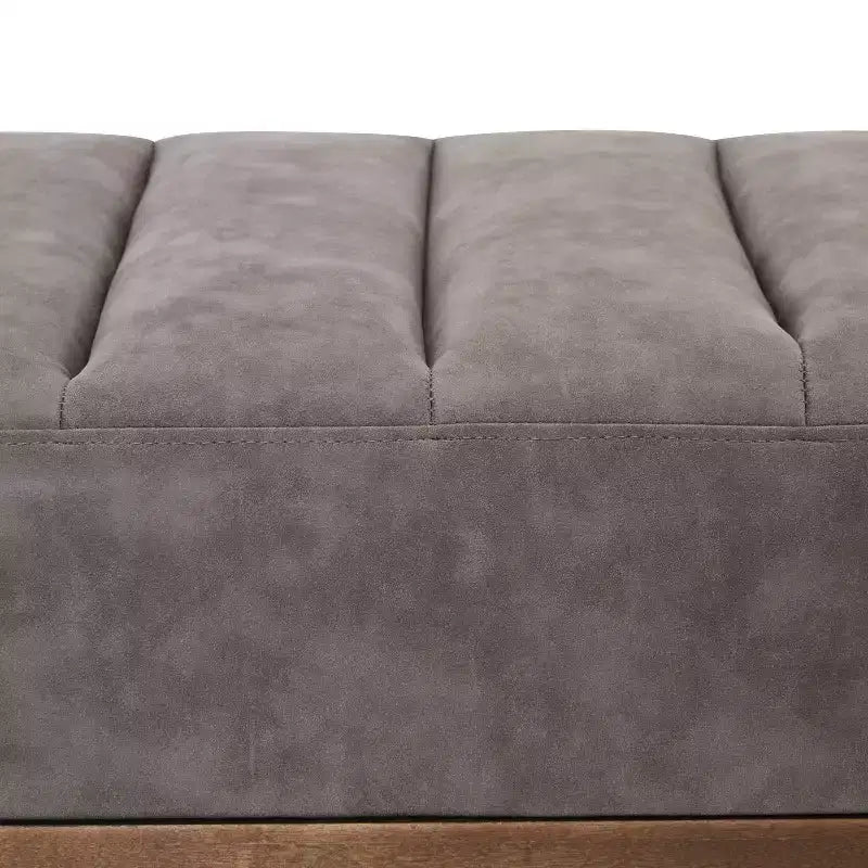 Pouffe matelassé moderne en similicuir 55 W avec base dorée
